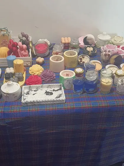 Another view of our event stall, this time showcasing our collection of handmade candles in various shapes, sizes, and containers.