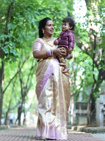 A mother and her young son share a happy moment during an outdoor family photoshoot. I look for these genuine expressions of joy.