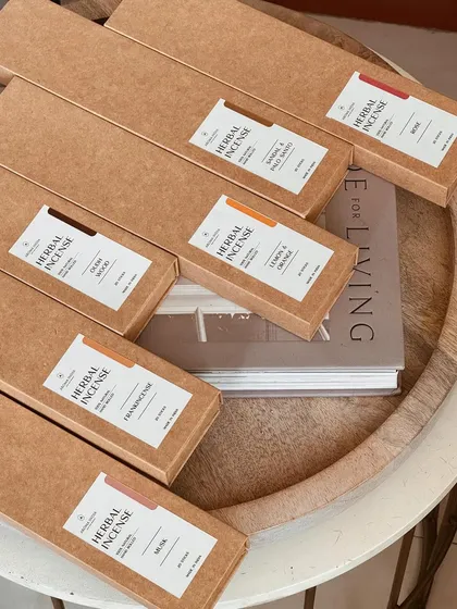 A top-down view of our various herbal incense fragrances, including Oud Wood, Rose, and Lemon & Orange. Each box contains hand-rolled sticks made from natural ingredients for a pure aromatic experience.