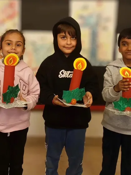 A trio of our students with their finished Christmas crafts. Our holiday workshops are designed to be fun, festive, and accessible for young children.