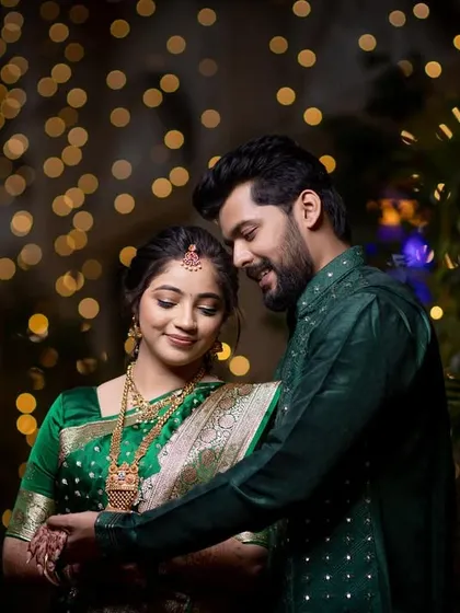 An elegant couple poses against a backdrop of sparkling bokeh lights during their evening celebration. I use creative lighting to create romantic and memorable engagement and reception portraits.