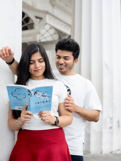 A candid moment of a couple sharing a book, showcasing their shared interests and connection. My goal is to create photos that feel like a natural extension of their relationship.
