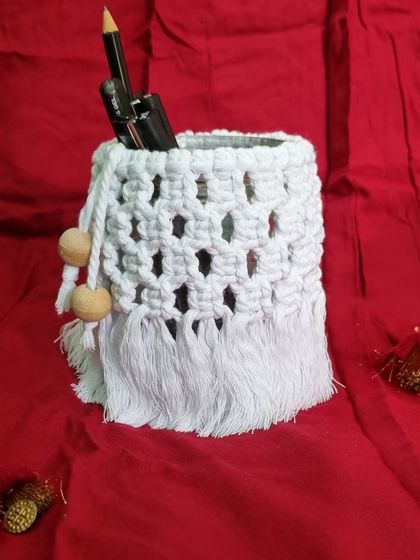 The versatile white jar cover used as a stylish pen and pencil holder for your desk.