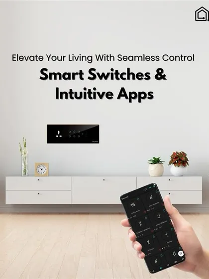 Get seamless control with our smart switches and intuitive app. This image shows a hand holding a phone with the control app, with the stylish switch panel visible in the background of a minimalist living space.