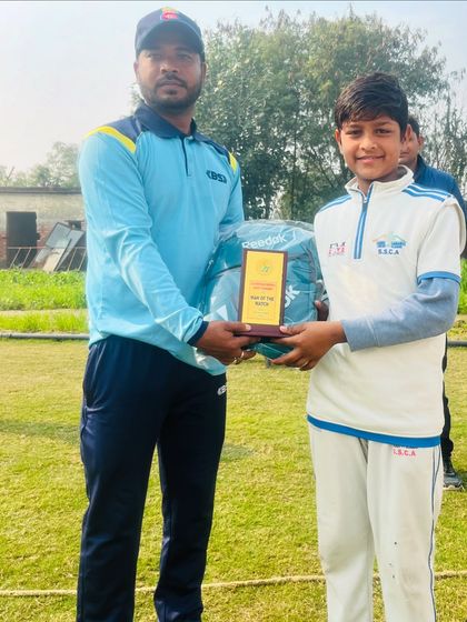 Sumit receiving the Man of the Match award for his fantastic bowling performance.