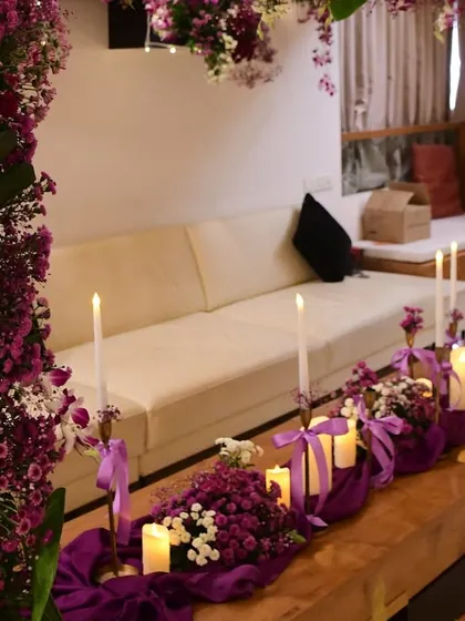 This angle shows how the floral arch perfectly frames the seating area, creating a cozy and defined space for the celebration.
