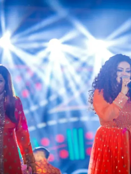 Singing together on stage, surrounded by incredible lighting. Our bond as sisters is what makes our performances so special and connected.