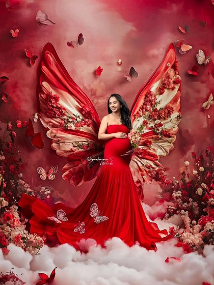 A fantasy edit with butterfly wings made of flowers, turning the maternity portrait into a piece of magical art.