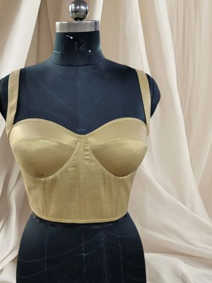 This elegant, statement corset is a must-have for your wardrobe. It can be paired with a saree, lehenga, trousers, or skirts. Each one is made to order for my clients.