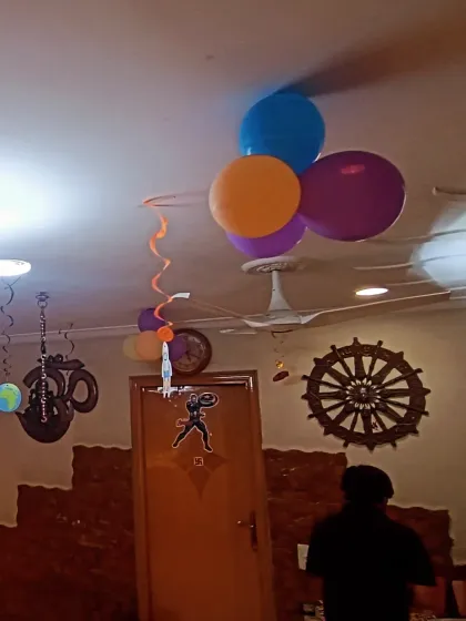 Even the ceiling gets the space treatment. Here you can see hanging planets and balloon bunches to make the entire room part of the theme.