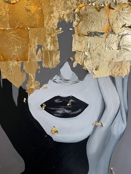 A close-up of the face in the gold leaf portrait. I left small, delicate flecks of gold on the lips and face, like fallen glitter.