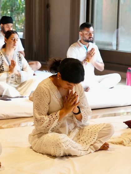 Participants deep in meditation during a workshop. The healing vibrations of our collective practice leave us feeling renewed, aligned, and deeply connected.