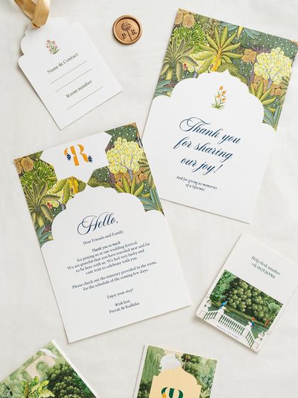 The full set of day-of stationery, including the welcome note, thank-you card, luggage tag, and pocket itinerary. The consistent design creates a seamless and professional experience.
