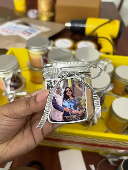 A close-up of the silver jubilee favor. The ombre wax colors were chosen to complement the couple's outfits in the photograph.