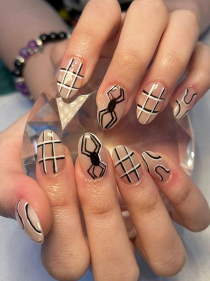 A full view of the edgy spiderweb nail art, perfect for Halloween or for anyone who loves a unique, graphic design.