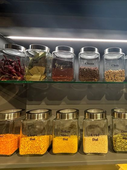 Another example of a well-stocked spice and dal cabinet. We always recommend organizing by category to make finding what you need quick and intuitive.