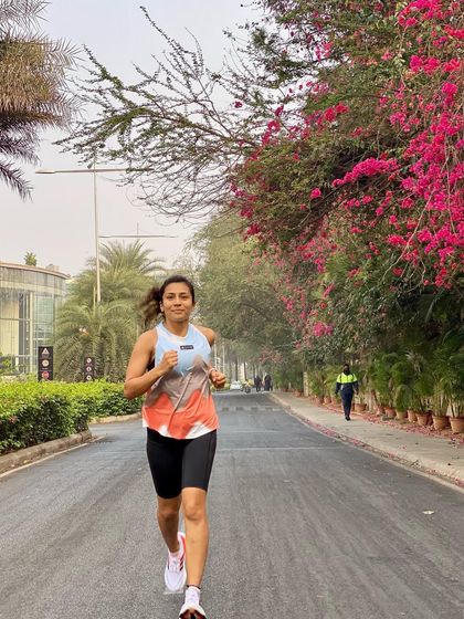 Running through a beautiful tree-lined street in my Ultraboost Light shoes. They make every run feel a little bit easier and more enjoyable.