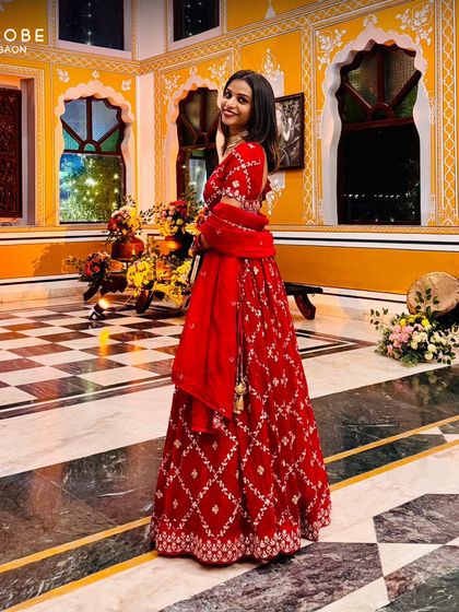 This classic red lehenga with diamond-patterned embroidery is a timeless choice for any wedding function. It's elegant, vibrant, and always in style.
