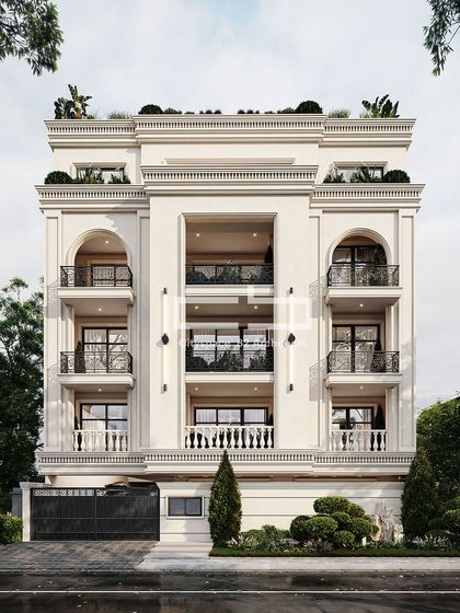 This elegant neoclassical residence exhibits a harmonious blend of symmetry and proportion. The facade is punctuated by a central double-height void and ornate wrought-iron railings, with lush rooftop landscaping offering a verdant contrast.