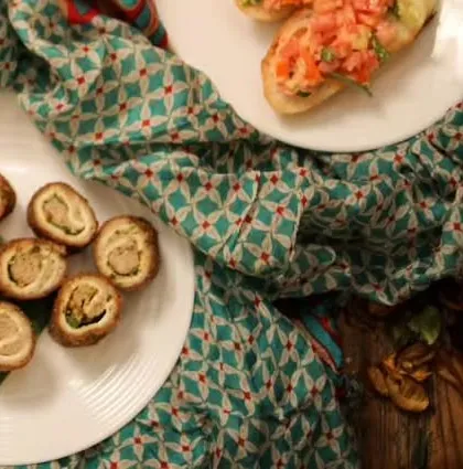 An overhead shot of the Chicken Swiss Rolls and bruschetta, showing a sample of the appetizer spread I can create.