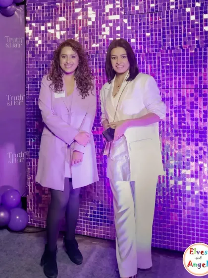 A shimmering sequin wall in the brand's signature purple provided the perfect photo opportunity at the Truth & Hair launch. These backdrops are fantastic for creating a glamorous, high-energy vibe that encourages social sharing.