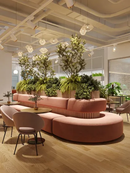 This circular sofa with an integrated central planter is a key feature of the breakout zone. It’s designed to be a natural gathering point, encouraging spontaneous conversations and connections.