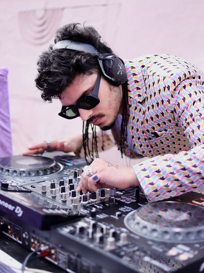 A close-up shot of me fine-tuning the sound on my Pioneer DJ console. I use top-of-the-line equipment to ensure crystal-clear audio quality for every event, indoors or outdoors.