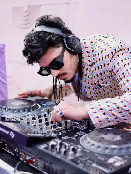 A close-up shot of me fine-tuning the sound on my Pioneer DJ console. I use top-of-the-line equipment to ensure crystal-clear audio quality for every event, indoors or outdoors.