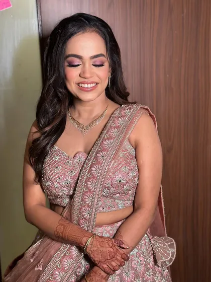 Another lovely portrait with her eyes closed, highlighting the blended eyeshadow and the overall softness of the makeup.