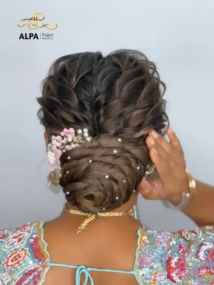 Another angle of the elegant bun, showing how the handmade accessory is placed to enhance the hairstyle.