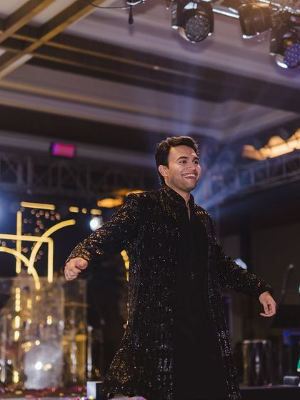The groom taking center stage with a confident and energetic performance. His smile says it all.