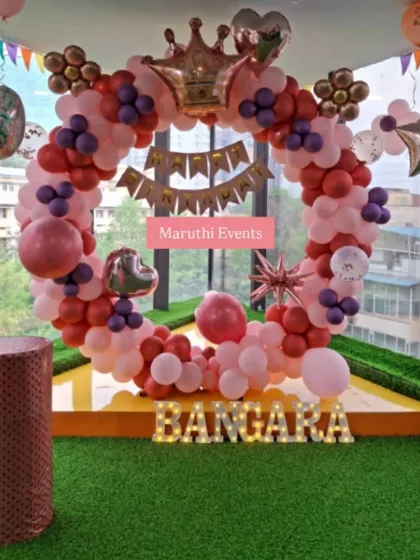 A royal-themed circular balloon arch in red, pink, and purple. The crown balloon on top makes it perfect for celebrating your little prince or princess.