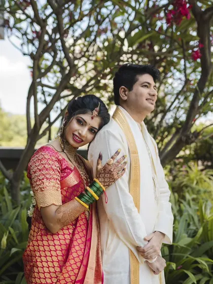 A sweet and relaxed portrait. The bride leans on her groom's shoulder, a simple pose that feels incredibly warm and genuine. Capturing these moments is what Weddings by Heart is all about.