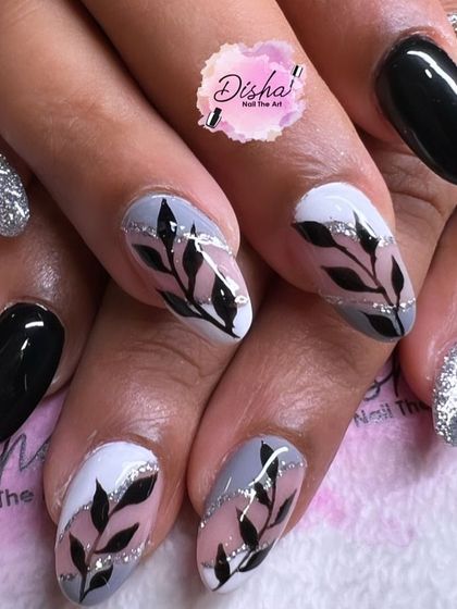 An elegant and sophisticated design. I combined solid black, glitter, and a delicate hand-painted leaf pattern for a look that is both chic and artistic.