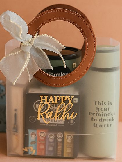 Our "best brother" hamper shown in its stylish transparent packaging with a leather-handle bag, making it easy to gift.
