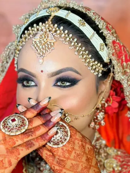 This is the magic of a classic bridal look. Here, I focused on creating a dramatic winged eyeliner and bold smokey eye that makes the bride's eyes pop, a technique I teach all my students for creating unforgettable wedding day makeup.