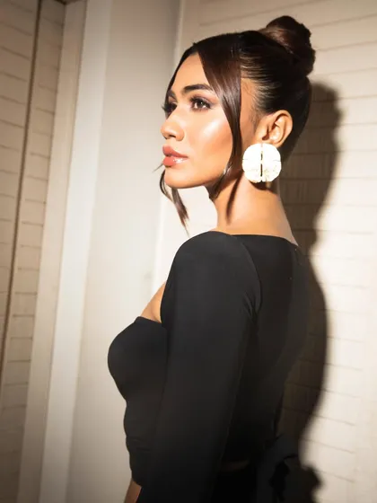 Another beautiful profile shot, this time with a softer light that enhances the dewy quality of the skin.