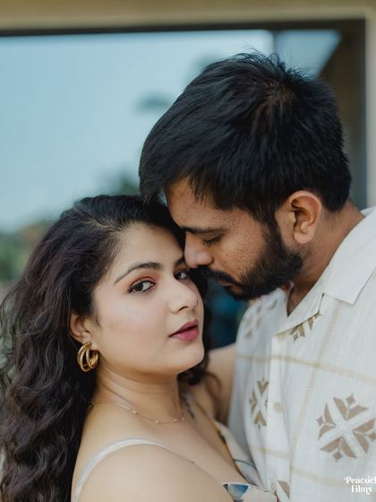 An intimate close-up from a pre-wedding session, capturing the bride's gaze as she looks up at her partner. It's a simple yet powerful portrait of love and trust.