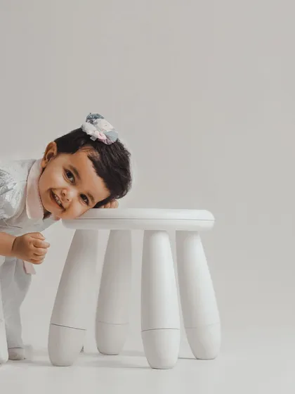A playful game of peek-a-boo with the camera. Toddler sessions are all about capturing their energy and emerging personality in a fun, relaxed way.