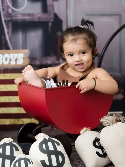 Howdy, partner! This little cowboy is ready to wrangle some fun in a western-themed photoshoot.