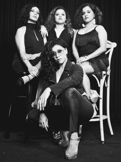 A classic black and white shot of our team. This image has a timeless, editorial feel, showcasing the strong and stylish presence of our dancers.