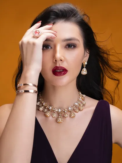 Another take from the same shoot, this time with a focus on the pose and expression. The styling, with the dark gown and statement jewellery, was designed to create a mood of confident, modern glamour.