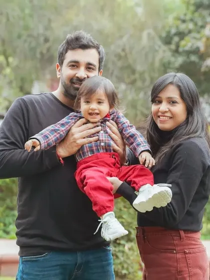A candid family moment during an outdoor shoot. We encourage play and natural interactions to capture authentic joy and create memories, not just pictures.
