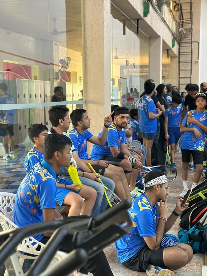 Our students watching their teammates compete during our matchplay event. The support and camaraderie on the sidelines are just as important as the action on court.