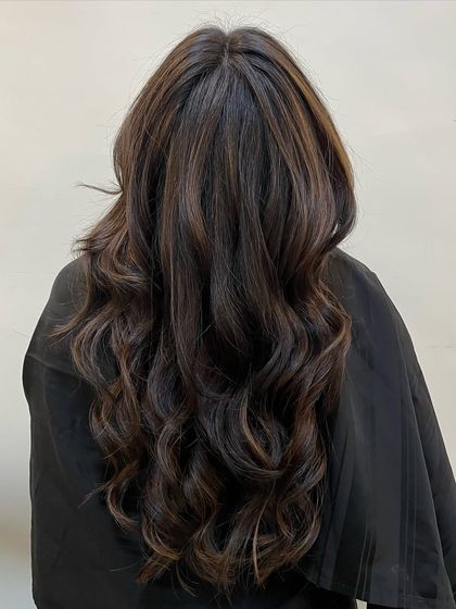 Gorgeous chocolate brown waves. This client came in for a transformation, and we gave her a rich, deep color with subtle dimension and a healthy shine.
