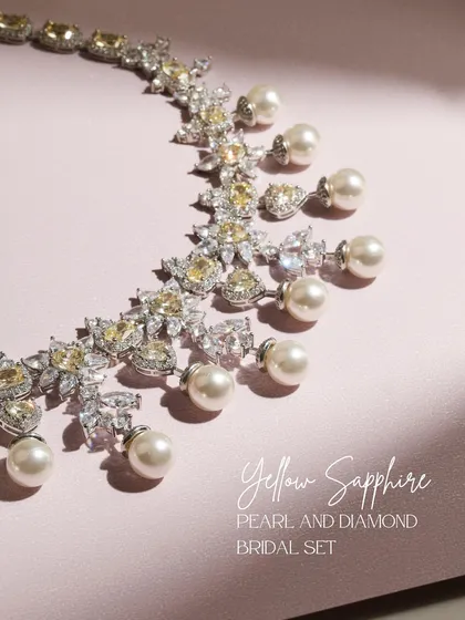 The Yellow Sapphire, Pearl, and Diamond Bridal Set, presented to highlight its golden hues and pure whites. This is a symphony of color and light for the modern bride.