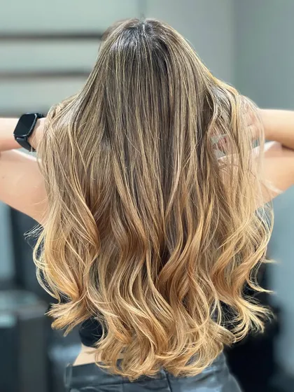 Another beautiful shot of the Blonde Airtouch Balayage, showcasing the length and health of the hair after coloring.