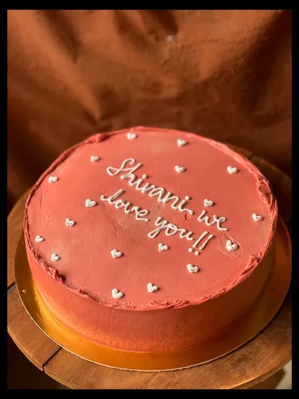 A simple, heartfelt cake with the message "Shivani, we love you!!".