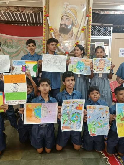 Students from our free workshop displaying their artwork on themes like patriotism and environmentalism. I am always impressed by their thoughtful and creative ideas.