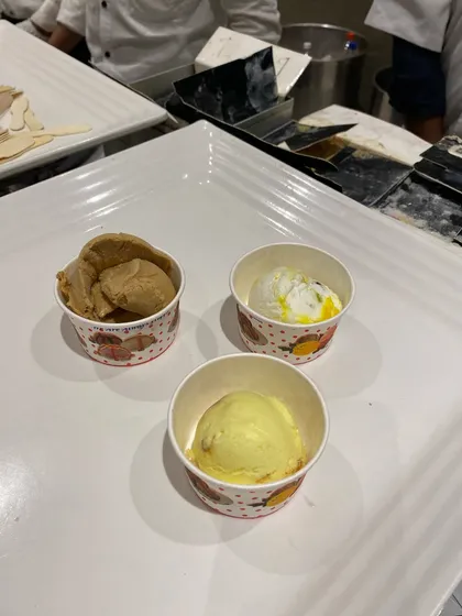 Small cups of assorted ice cream flavors, a simple and refreshing dessert option.